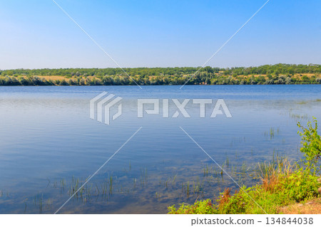 Summer landscape with beautiful river, green trees and blue sky 134844038