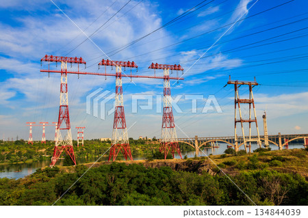 High voltage power line across the Dnieper river on Khortytsia island in Zaporizhia, Ukraine 134844039