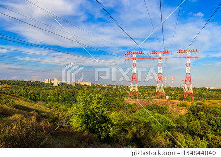 High voltage power line across the Dnieper river on Khortytsia island in Zaporizhia, Ukraine High voltage power line across the Dnieper river on Khortytsia island in Zaporizhia, Ukraine 134844040