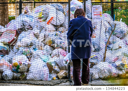 Yokohama cityscape, Japan - End of the year... Garbage dump on a street corner. A huge pile of garbage on the last collection day of the year... = 30th, Yokohama city 134844223