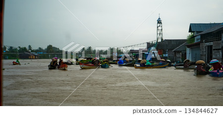 Beautiful view of Mertapura River floating market, South Kalimantan, Indonesia Beautiful view of Mertapura River floating market, South Kalimantan, Indonesia 134844627
