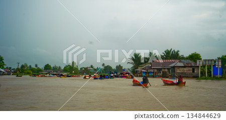 Beautiful view of Mertapura River floating market, South Kalimantan, Indonesia Beautiful view of Mertapura River floating market, South Kalimantan, Indonesia 134844629