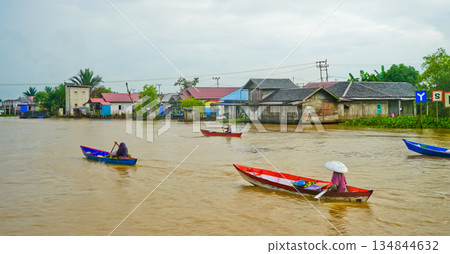 Beautiful view of Mertapura River floating market, South Kalimantan, Indonesia 134844632