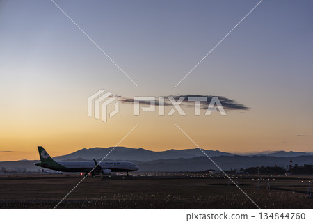 Sendai Airport at dusk, airplane taxiing, silhouette, Natori City, Miyagi Prefecture 134844760