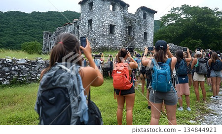 Tourists Photographing Stone Ruins in Tepoztlan, Mexico, with Lu 134844921