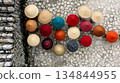 Colorful Conical Hats Displayed on Stone Wall, Overhead View, Ma 134844955