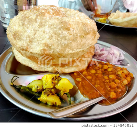 Chole bhature is a North Indian famous food dish Chole bhature is a North Indian famous food dish 134845051