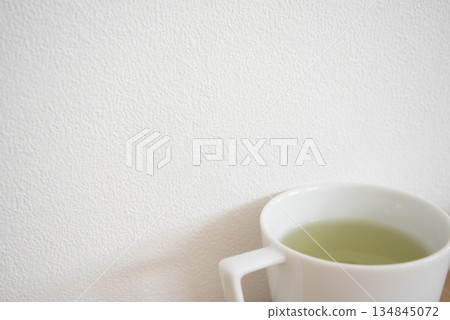Green tea in a white cup Green tea in a white cup 134845072