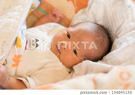 Japanese baby boy sleeping in a crib Japanese baby boy sleeping in a crib 134845139