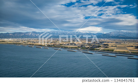 A winter view of the Kurobe River alluvial fan from the coastline of the Sea of Japan A winter view of the Kurobe River alluvial fan from the coastline of the Sea of Japan 134845761
