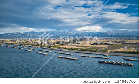 A winter view of the Kurobe River alluvial fan from the coastline of the Sea of Japan A winter view of the Kurobe River alluvial fan from the coastline of the Sea of Japan 134845766