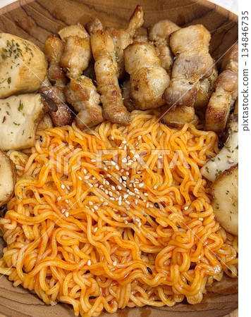 Spicy and tangy bibim guksu with chewy noodles, fresh veggies, and gochujang sauce. A vibrant and refreshing Korean cold noodle dish perfect for a light yet flavorful meal. Spicy and tangy bibim guksu with chewy noodles, fresh veggies, and gochujang sauce. A vibrant and refreshing Korean cold noodle dish perfect for a light yet flavorful meal. 134846735