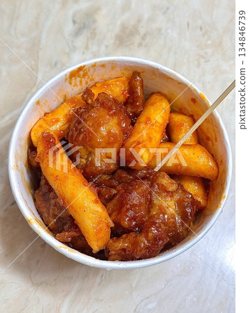 Crispy Korean fried chicken, perfectly glazed with a sweet and spicy sauce. Ideal for food photography and menus, showcasing the irresistible crunch and flavor of this beloved dish. 134846739