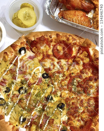 A delicious pizza with a golden crust, melted cheese, and savory toppings. Perfect for food-related designs, menus, or Italian-themed projects, capturing the essence of a classic comfort dish. 134846740