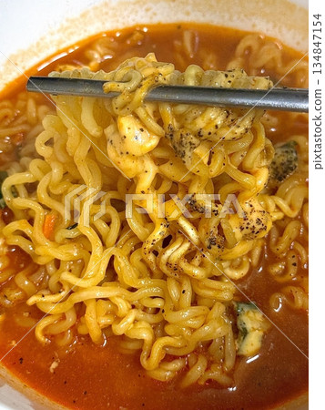 Shin Ramyun,close up of Ramyeon or Ramyun is a Korean-style soup noodle dish with a spicy flavor. Ramyeon or Korean instant noodles with egg - Korean food style Shin Ramyun,close up of Ramyeon or Ramyun is a Korean-style soup noodle dish with a spicy flavor. Ramyeon or Korean instant noodles with egg - Korean food style 134847154