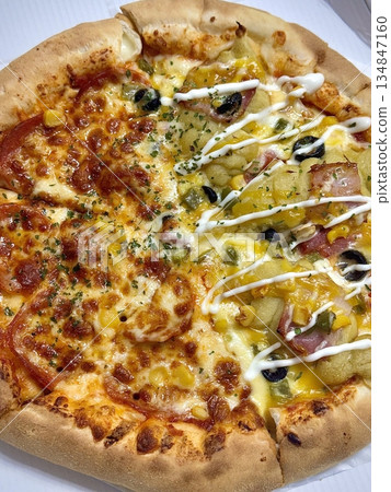 A delicious pizza with a golden crust, melted cheese, and savory toppings. Perfect for food-related designs, menus, or Italian-themed projects, capturing the essence of a classic comfort dish. A delicious pizza with a golden crust, melted cheese, and savory toppings. Perfect for food-related designs, menus, or Italian-themed projects, capturing the essence of a classic comfort dish. 134847160