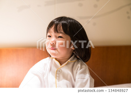 Japanese toddler girl relaxing in a luxury hotel room Japanese toddler girl relaxing in a luxury hotel room 134848927