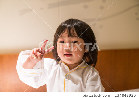 Japanese toddler girl relaxing in a luxury hotel room Japanese toddler girl relaxing in a luxury hotel room 134848929