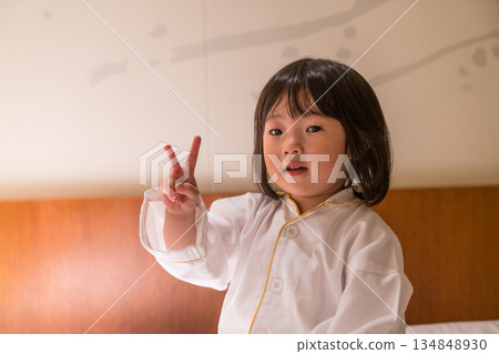 Japanese toddler girl relaxing in a luxury hotel room Japanese toddler girl relaxing in a luxury hotel room 134848930