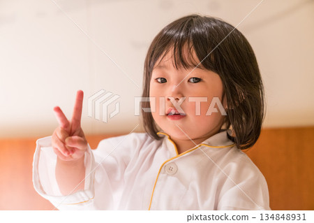 Japanese toddler girl relaxing in a luxury hotel room Japanese toddler girl relaxing in a luxury hotel room 134848931