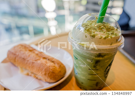 Matcha frappe and panini at the cafe Matcha frappe and panini at the cafe 134848997