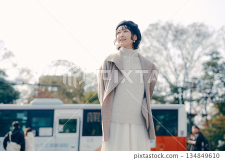 Full-body portrait of a woman in her 30s standing outdoors Full-body portrait of a woman in her 30s standing outdoors 134849610