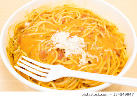 Delicious tomato cream pasta topped with real snow crab Delicious tomato cream pasta topped with real snow crab 134849947
