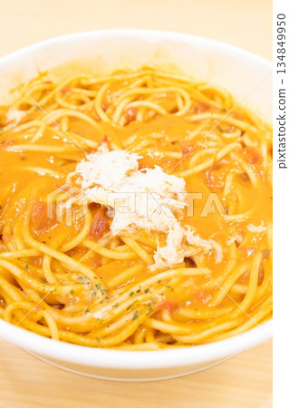 Delicious tomato cream pasta topped with real snow crab Delicious tomato cream pasta topped with real snow crab 134849950