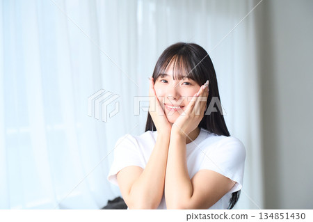 A young woman doing skin care 134851430