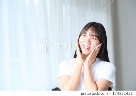 A young woman doing skin care A young woman doing skin care 134851431