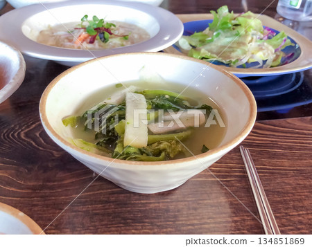 Refreshing Yeolmu Water Kimchi Served as a Traditional Korean Summer Side Dish on a Wooden Table 134851869