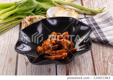 Razor shell mollusk with sauce Razor shell mollusk with sauce 134851963