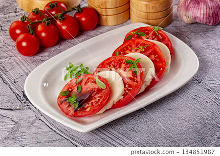 Italian caprese salad with mozzarella, tomato and basil Italian caprese salad with mozzarella, tomato and basil 134851987