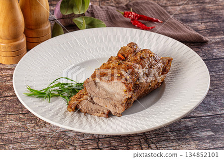 Baked pork sirloin with spices Baked pork sirloin with spices 134852101