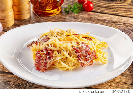 Italian classic spaghetti carbonara with bacon and egg Italian classic spaghetti carbonara with bacon and egg 134852158