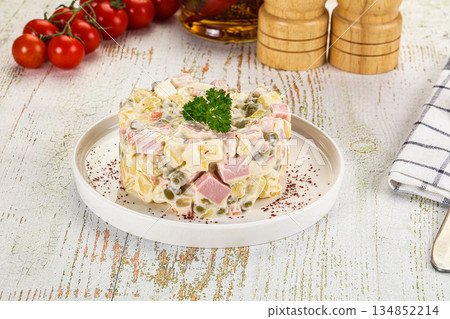 Russian traditional Olivier salad with sausages 134852214