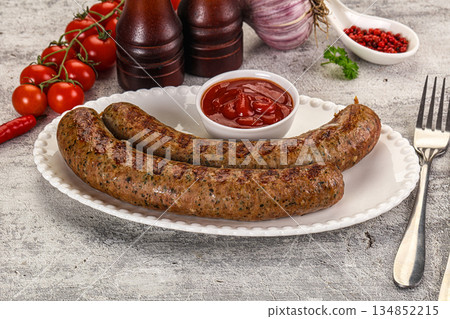 Grilled beef sausages with sauce Grilled beef sausages with sauce 134852215