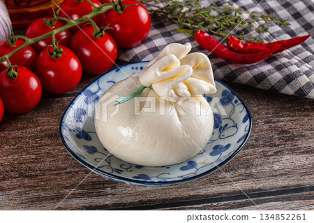 Fresh tasty burrata italian cheese Fresh tasty burrata italian cheese 134852261