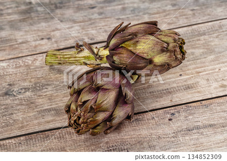 Organic food - Ripe raw green artichoke Organic food - Ripe raw green artichoke 134852309