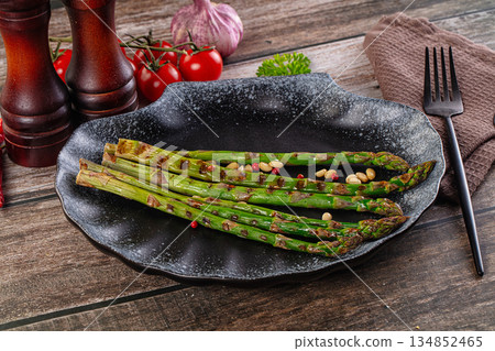 Grilled asparagus sprouts with cedar 134852465