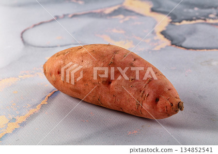 Raw sweet potato for cooking Raw sweet potato for cooking 134852541