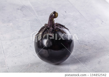 Raw round black big eggplant Raw round black big eggplant 134852542