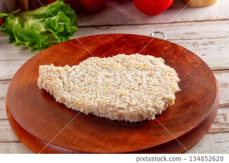 Raw breaded schnitzel for roast 134852620