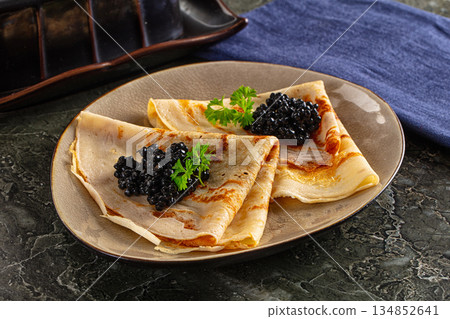luxury pancake with black caviar luxury pancake with black caviar 134852641