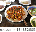 Spicy Korean Jjukkumi Stir Fry with Vegetables Served as a Traditional Korean Main Dish on a Wooden Table 134852685