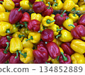 Fresh Red and Yellow Bell Peppers Displayed in Abundance at a Market, Colorful and Healthy Vegetables Background 134852889