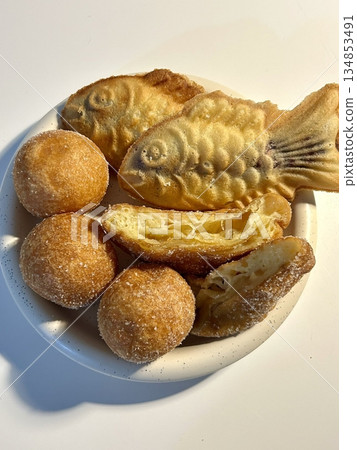 Bungeoppang, bungeo-ppang (Korean Fish Shaped Pastry), popular snack, cookies, sweet in winter streets of Korea. Bungeoppang Korean traditional national food, dish, cuisine. Japanese taiyaki 134853491
