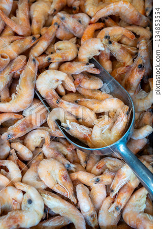Frozen Shrimp In Metal Scoop At Market, Fresh Seafood For Cooking Frozen Shrimp In Metal Scoop At Market, Fresh Seafood For Cooking 134853554