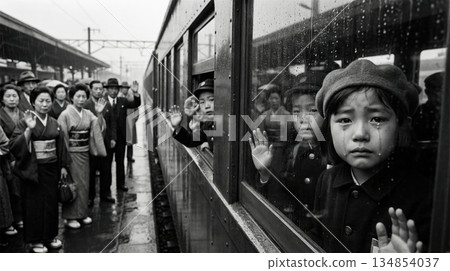 A girl crying and looking out from inside an evacuation train 134854037