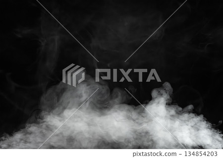 Wisps of white smoke isolated on a black background with space for text. 134854203